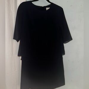 Navy blue midi dress with pleated bottom.